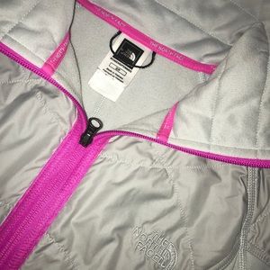 Gray and pink North Face jacket